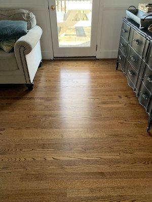 Installed new unfinished wood floor to replace carpet in a den and sanded and finished to match existing flooring in the house.