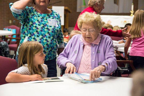 What a fun activity!  The school came to visit with our Elders and read books together.