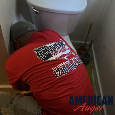 One of our highly trained technicians setting a toilet.