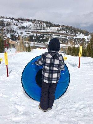 Sledding just outside the condos