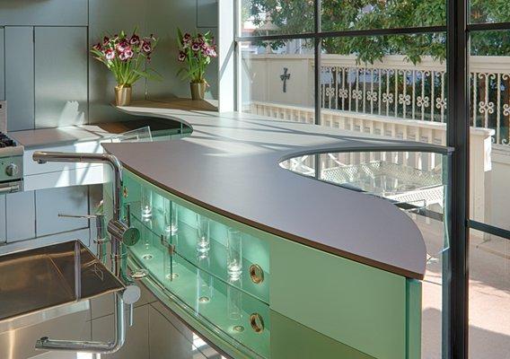 Floating, free-form counter accents this modern San Francisco kitchen.