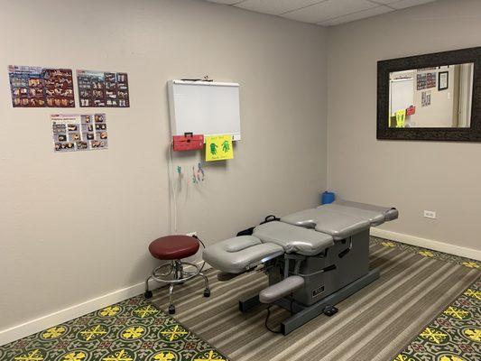 Exam/treatment room for consult/exam, adjustments, Active Release and other myofascial release treatments, as well as heat/ice.