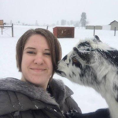 S.J. gets a kiss from Star, a very friendly goat.