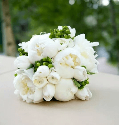 all white peonies and ranunculus bouquet