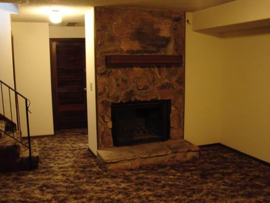 In our single story units the wood-burning fireplace is in the family room in the full, finished basement