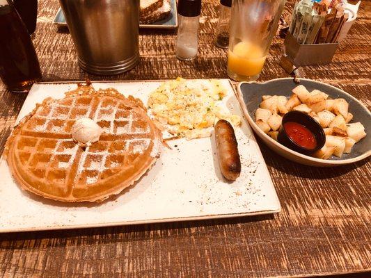 Belgian Waffle with scrambled eggs,sausage link,and home fried potatoes..!