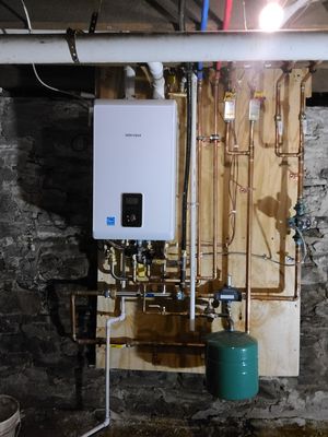 New high efficiency combination tankless boiler that provides endless hot water and heating!