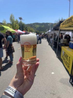 Souvenir glass and rows of breweries