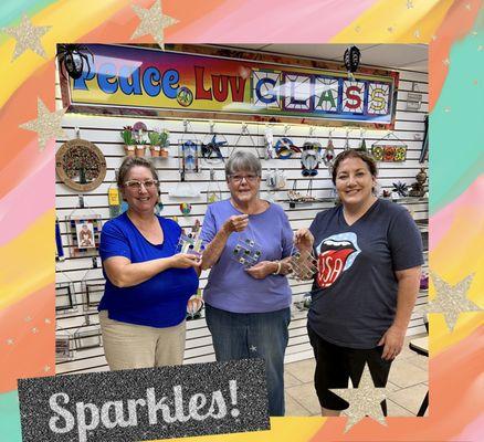 A small group creating their very own Stained Glass Jeweled Bevel Suncatcher at PeaceLuvGlass.