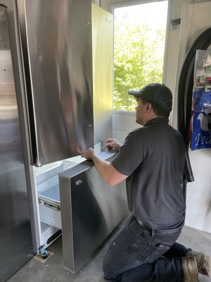 Todd adjusting the door so that they were perfectly level.