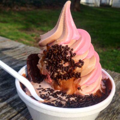 This is chocolate and raspberry dole brownie sundae with chocolate sprinkles!