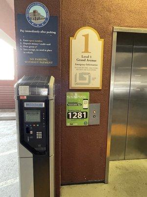 Payment kiosks next to elevator on first floor