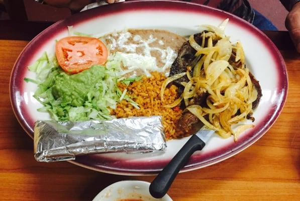 Steak fajitas with beans and Spanish rice. Very tasty.