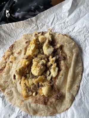 Bacon dust and egg breakfast.  That is one sad bacon and egg taco.  Flour tortillas are good.