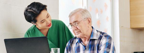 Caregiver helping senior man