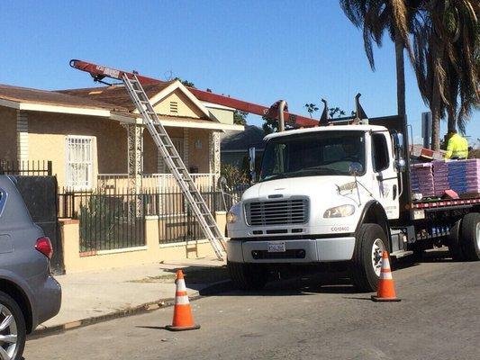 Loading up roofing materials to get the job done.