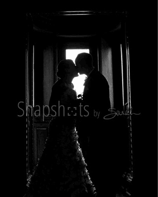 Bride & groom kiss at Landmark Center, St. Paul MN