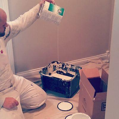 painting contractor Anthony Ford Proprietor of ExtraPrep Pro Painting pours ceiling paint at a home in Crittenden, KY