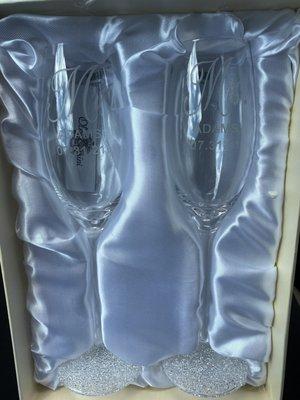 2 Engraved Champagne Glasses.