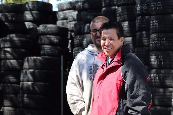 The Chief, The Head Honcho, The Boss, The Man assisting those in need of tires himself... (behind him a kind and hard worker).