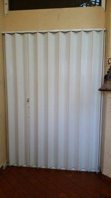 white hurricane shutter for doors