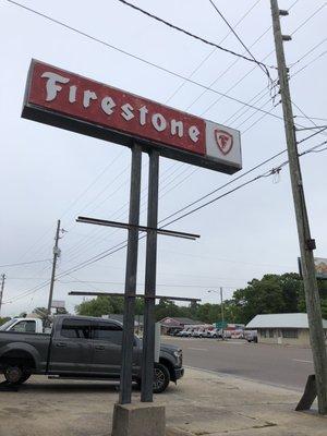 The sign outside the firestone.