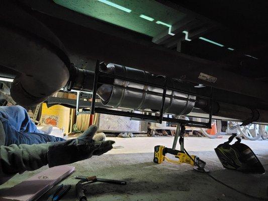 Catalytic converter installation with security cage.