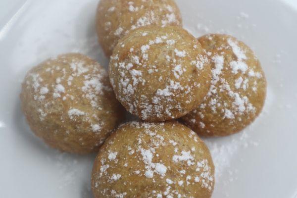 Fried dough with powdered sugar on top.