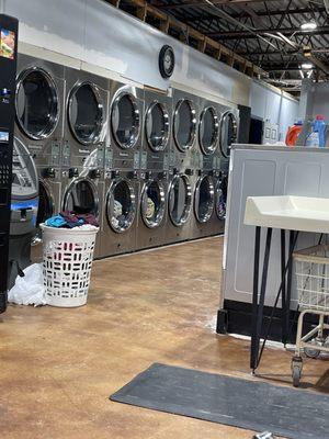 Dryers on one side of room. Two sizes.