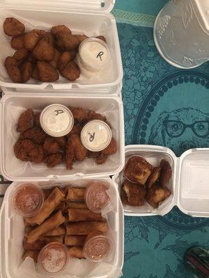 Double orders of broccoli cheese bites, fried chicken pieces, and vegetable egg rolls. 1 order of fried cheese ravioli.