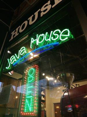 Restaurant name and open sign in neon lights