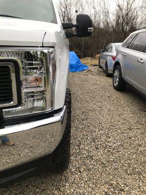 Tire stick out now after ford did the leveling kit doesn't on passenger side.