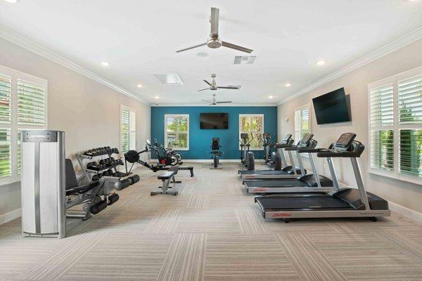 Fitness center with cardio  and weight machines.