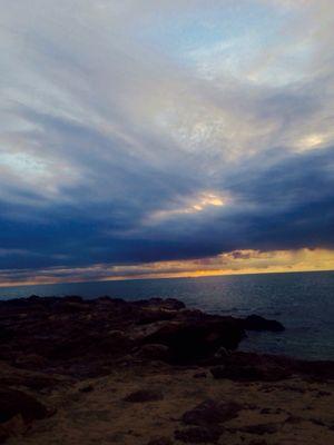 Gorgeous sunset in Makaha. The clouds are really cool