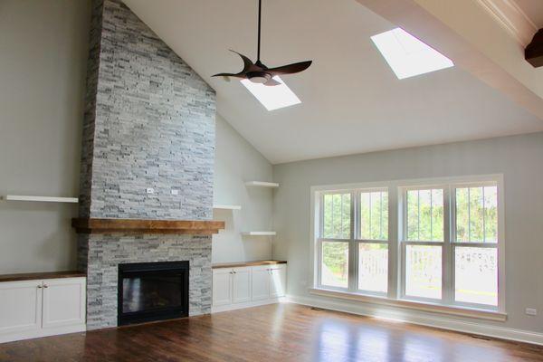 Custom Built Fireplace, Cabinets, and Floating Shelves