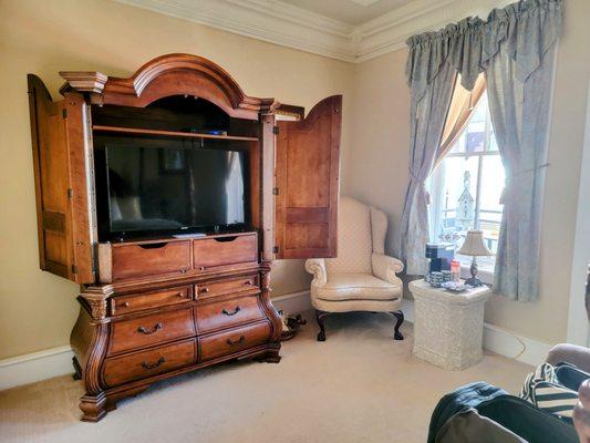 Gorgeous TV armoire and a nice coffee/tea center with the balcony just outside