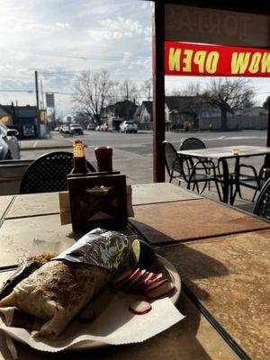 Burrito con pollo on the patio, served with grilled onions and a jalapeño