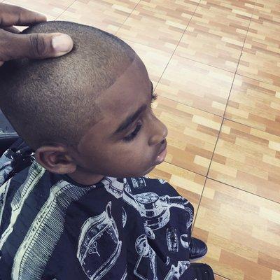 Young Joshua, my number one customer. He loves his little brush cuts