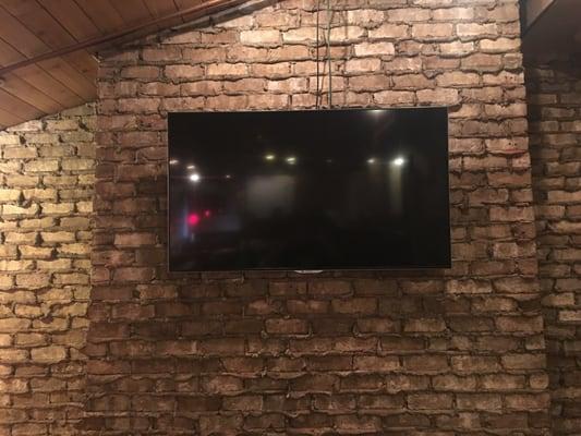 60" Sharp mounted in the main dining area of the Fusion Bar & Grille.