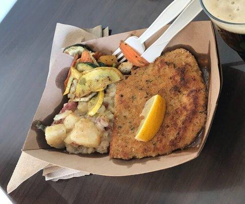 Wiener schnitzel, warm German potato salad, and fresh veggies.