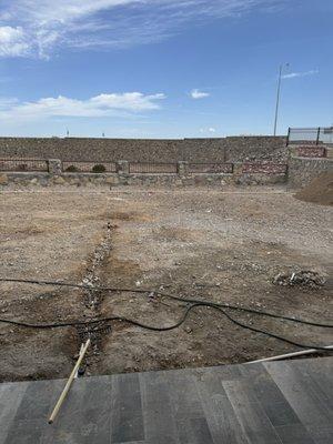 The trench for the irrigation system being dug out.