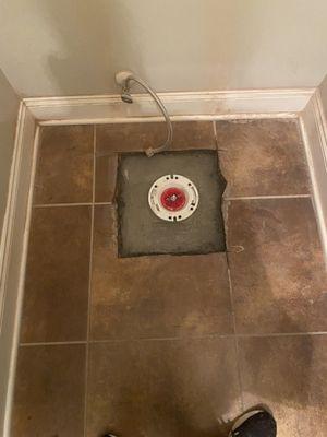 BEFORE:
Toilet was removed. New toilet showed the previous hole. 4 tiles were replaced. Regrout