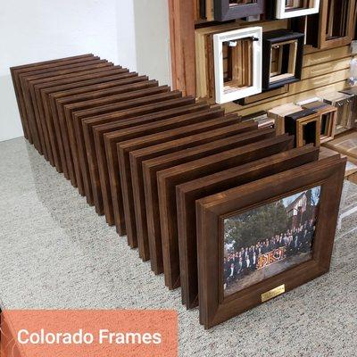 Custom framed photos with custom plaque in stock moulding in quantity