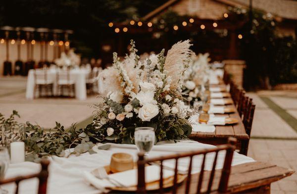 Dinner table with flower arrangements