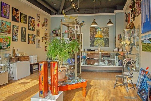 Front gallery and boutique space with art, jewelry, and home decor.