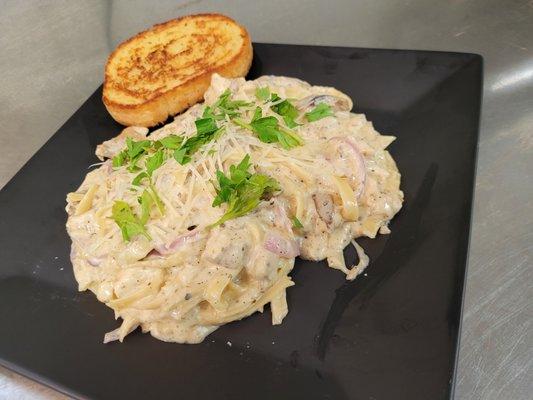 Feast your eyes, and yourselves, on our tasty Chicken Fettuccini Alfredo! So good you'll wish you had room for another plate!