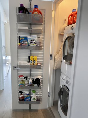 Laundry room. The addition of the over-the-door hanger and storage area above the dryer is truly genius.