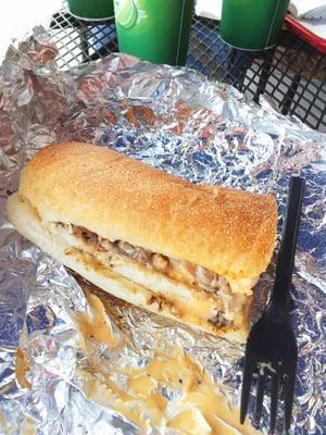 The Packer includes three cheeses in the philly cheese steak. The picture shows just half the sandwich.