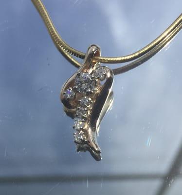 Gold and diamond pendant