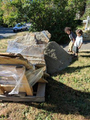 Huge slabs of patio stones, we spent hours breaking up. Gravel dumped on our grass despite the $100+ delivery fee and $25 gravel bin fee.